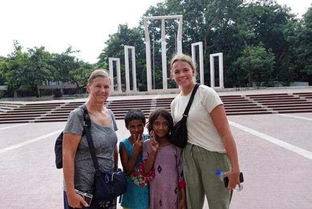 Mother and Daughter from Belgium with Local Children at Shahid Minar
