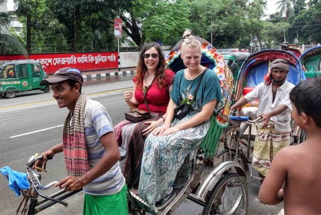 Tourist on a Rickshaw During Old Dhaka Tourin a local way