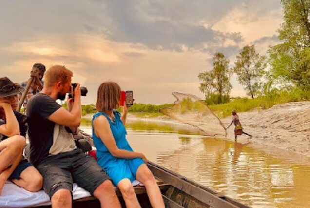 sundarban tour in a different way - Tourist taking photo of a fisherman