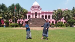 Dhaka City Tour: Tourist on traditional Dress (Lungi) in front of Pink Palacewith a Local Dhaka Tour Guide