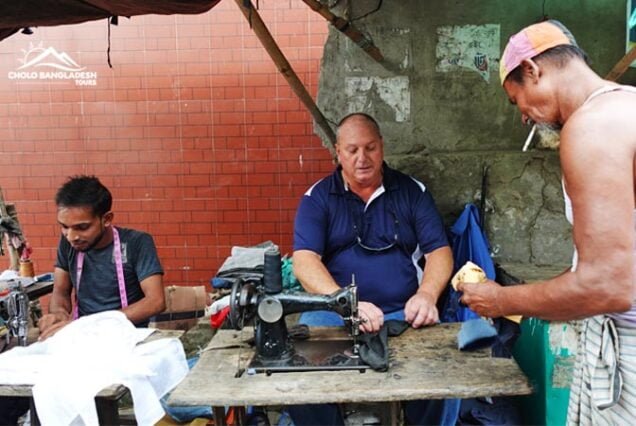 Old Dhaka Tour like a local : Tourist Trying to a street tailor