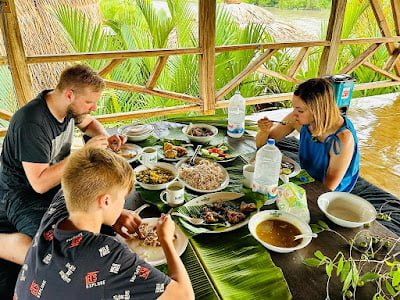 Tourists having lunch at the eco friendly resort