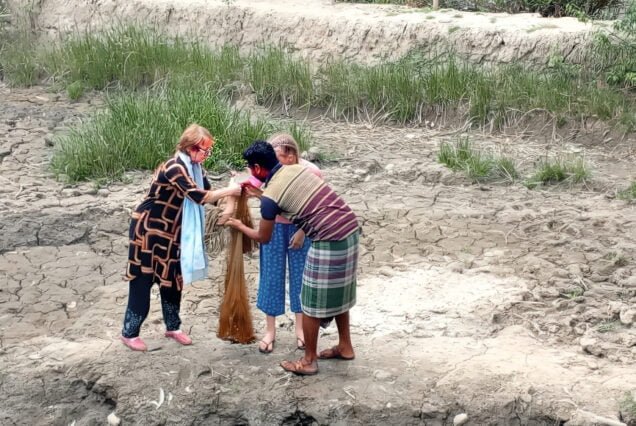 tourist trying to do fishing by local net