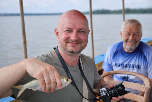Traveler carryingt Hilsha National fish during barishal backwater tour